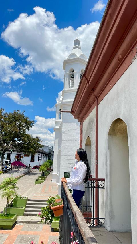 A street beside a white church