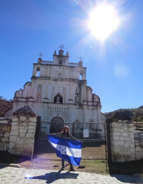 An old church with the Honduran flag