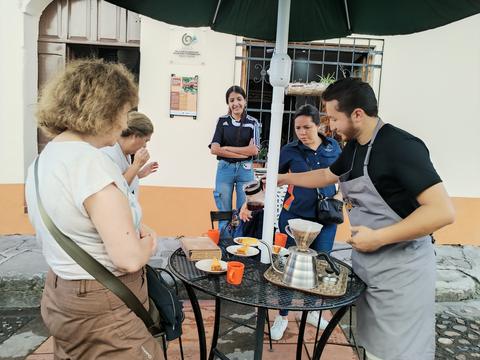 A cook serving visitors
