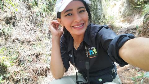 A guide taking a selfie in the forest