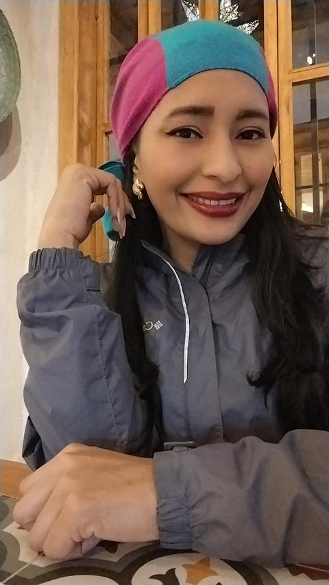 A guide smiling in a café
