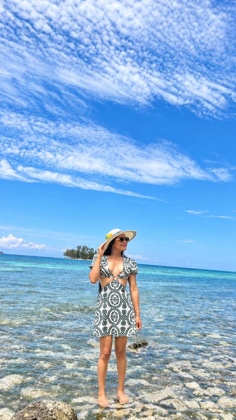 A person on a clear-water beach