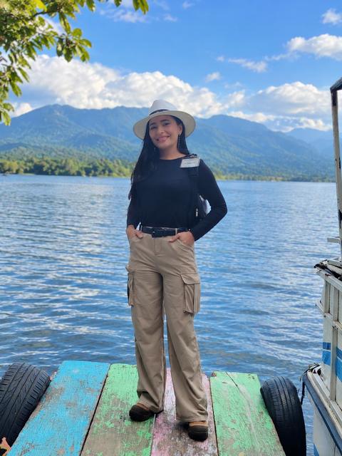 A person on a dock by a lake