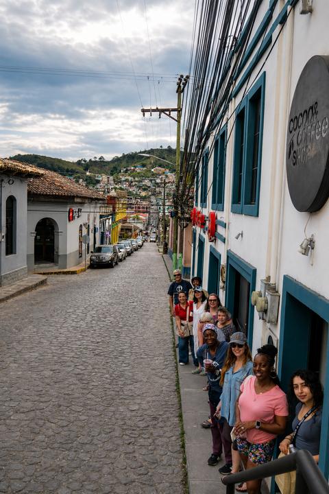 A cobbled street with colonial houses