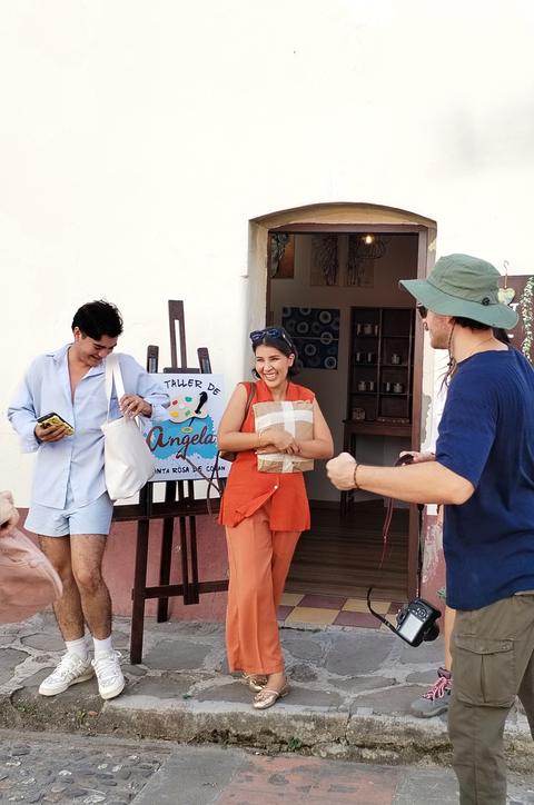 Visitors chatting at a shop entrance