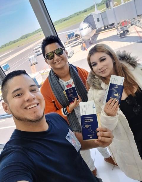 Travellers with passports taking a selfie