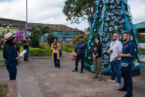 A group beside a Christmas tree